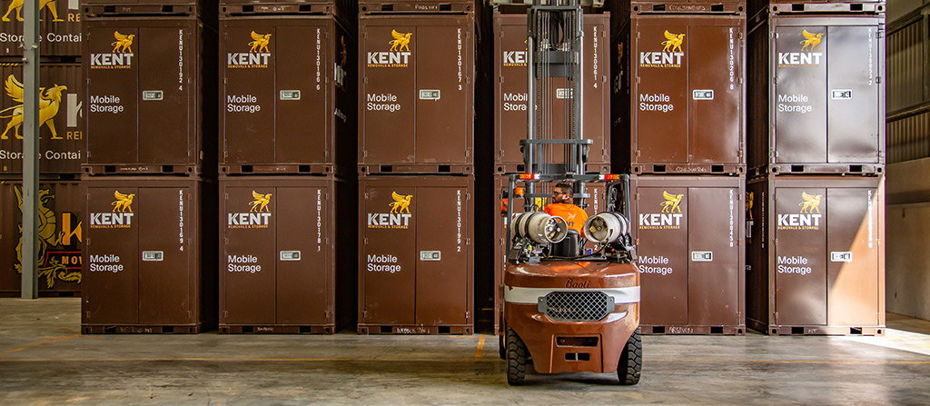 Do Companies Abandon Storage Units? 1 Kent Storage Forklift Stacking Containers