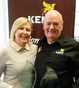 Kent Recognised by TheMIGroup at Worldwide Partnership Awards 2 Graham Kent presenting TheMIGroup excellence awards to Lisa Fink image
