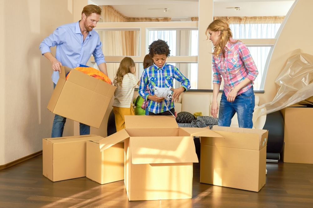 Kids and parents packing to move home